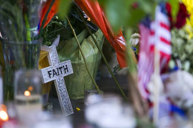 A memorial is shown in front of CiCi's Pizza, where two Metro Police officers were killed, during a community vigil Monday,, Nevada June 9, 2014. Police officers Alyn Beck, 41, and Igor Soldo, 31, were ambushed and killed in the restaurant while they were eating lunch on June 8.