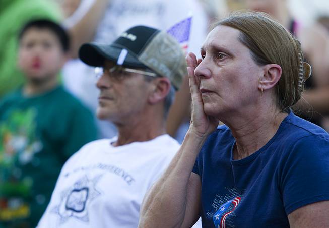 Larry Gold, left, and his wife Deborah attend a community vigil for two slain Metro Police officers at CiCi's Pizza Monday,, Nevada June 9, 2014. Officers Alyn Beck, 41, and Igor Soldo, 31, were ambushed and killed in the restaurant while they were eating lunch on June 8.