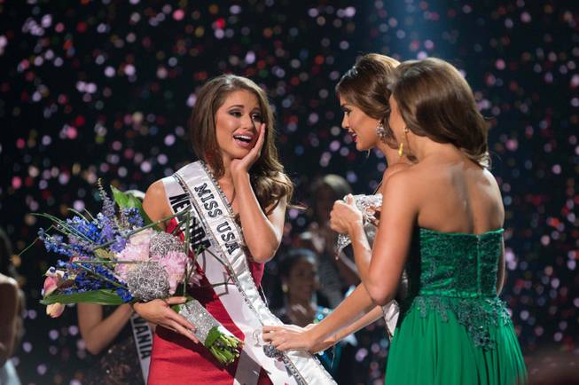 2014 Miss Nevada USA Nia Sanchez is crowned 2014 Miss USA at the 2014 Miss USA Pageant at Baton Rouge River Center on Sunday, June 8, 2014, in Baton Rouge, La. Runner-up 2014 Miss North Dakota Audra Mari is at center and 2013 Miss USA Erin Brady is at right.

