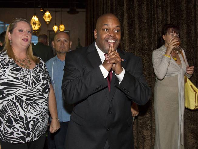 Congressional candidate Niger Innis for the 4th District, is pleased with the election results so far while Republicans are gathered at Mundo restaurant on Monday, June 9, 2014.