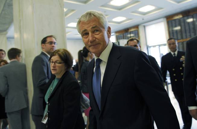Defense Secretary Chuck Hagel arrives on Capitol Hill in Washington, Wednesday, June 11, 2014, to testify before the House Armed Services Committee.