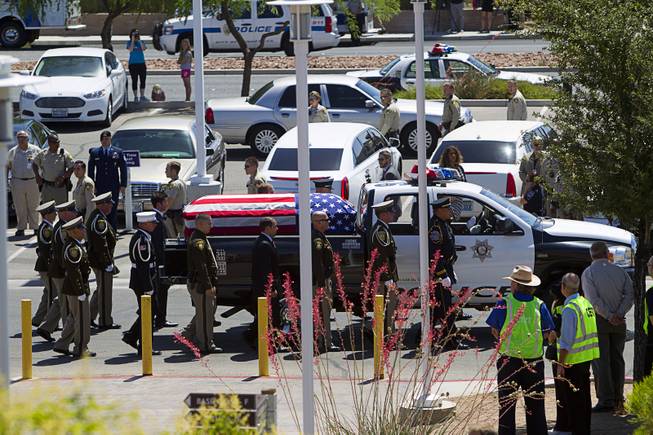 A truck with the casket containing Metro Police officer Igor Soldo arrives for funeral services at Canyon Ridge Church Thursday, June 12, 2014. Soldo and Metro Police Officer Alyn Beck where ambushed and killed by Jerad and Amanda Miller while eating lunch on Sunday, June 8.