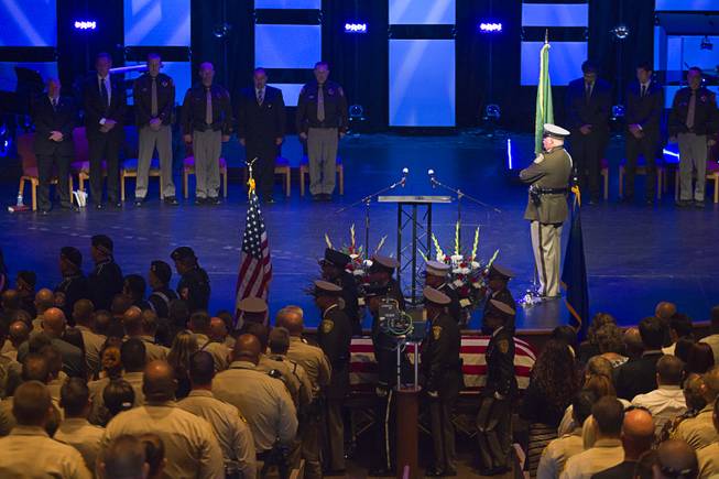 An honor guard carries the casket of Metro Police officer Igor Soldo following a funeral service at Canyon Ridge Church Thursday, June 12, 2014. Soldo and Metro Police Officer Alyn Beck where ambushed and killed by Jerad and Amanda Miller while eating lunch on Sunday, June 8.