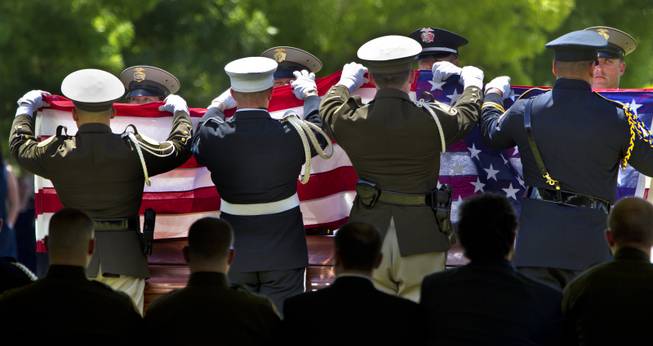 An American flag is folded to be given to Andrea Soldo during funeral services for her husband, slain Metro Officer Igor Soldo, at the Palm Mortuary on Thursday, June 12, 2014.
