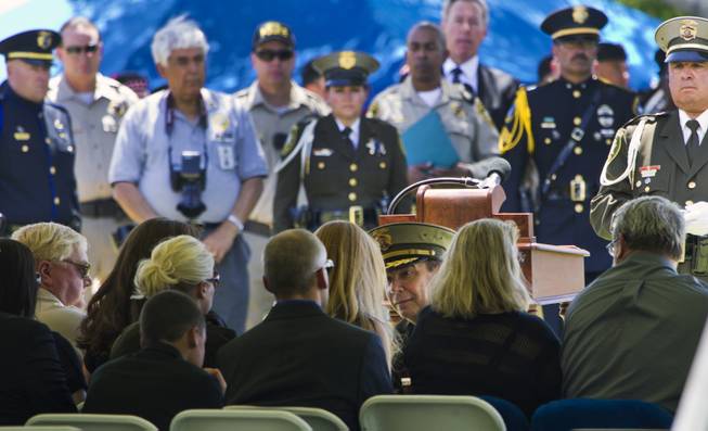 Clark County Sheriff Doug Gillespie presents a folded American flag to Andrea Soldo, the wife of slain Metro Officer Igor Soldo, during funeral services at the Palm Mortuary on Thursday, June 12, 2014.
