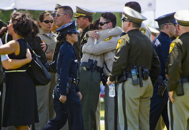Officers and supporters come together following funeral services for slain Metro Officer Igor Soldo at the Palm Mortuary on Thursday, June 12, 2014.