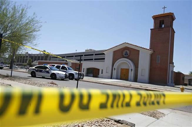 Phoenix police were still on the scene after a Wednesday evening attack left a priest shot and killed and another injured at the Roman Catholic church the Mother of Mercy Mission on Thursday, June 12, 2014, in Phoenix. Police have no suspects at this point, but they are canvassing the neighborhood and going over physical evidence from the scene.