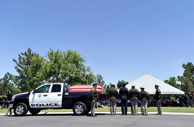 Police honor guard members await receiving the casket of Las Vegas police officer Igor Soldo during funeral services for him at Palm Northwest Mortuary & Cemetery on Thursday, June 12, 2014 in Las Vegas. Soldo, 31, and fellow officer, Alyn Beck, 41, were gun down by two assailants at a Cici's Pizza during their lunch break Sunday. Services for Beck are scheduled for Saturday. 