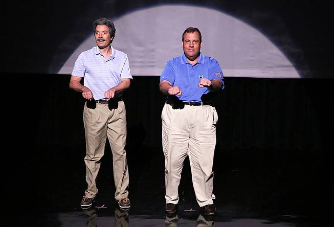 This Thursday, June 12, 2014, photo provided by NBC shows host Jimmy Fallon, left, and Governor Chris Christie during the "Evolution of Dad Dancing" skit on "The Tonight Show Starring Jimmy Fallon." 