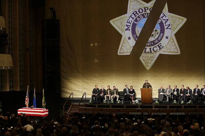 County Sheriff Doug Gillespie speaks at a memorial service for Las Vegas Metropolitan Police Officer Alyn Beck at The Smith Center for the Performing Arts Saturday, June 14, 2014 in Las Vegas. Two suspects shot and killed Beck, 41, and fellow police officer Igor Soldo, 31, in an ambush at a Las Vegas restaurant Sunday, June 8, 2014, before fatally shooting a third person inside a nearby Wal-Mart, authorities said.