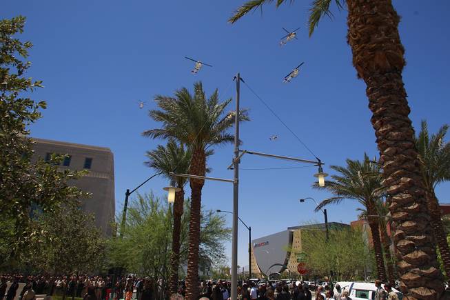 Metro helicopters make a fly by during a memorial service for Metro officer Alyn Beck Saturday, June 14, 2014 at the Smith Center for the Performing Arts.