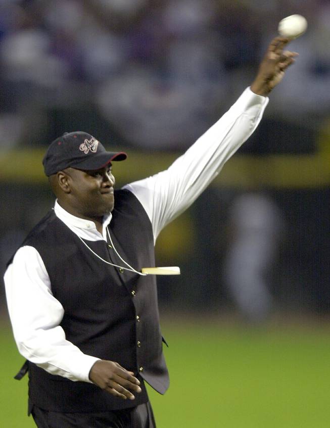 Retired San Diego Padres outfielder Tony Gwynn throws out the first pitch of Game 6 of the World Series between the Arizona Diamondbacks and the New York Yankees Saturday, Nov. 3, 2001, at Bank One Ballpark in Phoenix. 