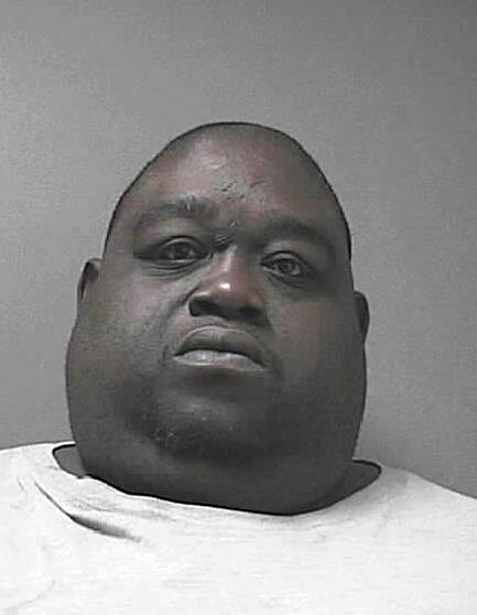 This Friday, June 13, 2014, arrest photo provided by the Volusia County Sheriff's Office, shows Christopher Mitchell, 42. Mitchell, who weighs about 450 pounds, was arrested and is facing multiple charges after sheriff's deputies say he hid cocaine and 23 grams of marijuana under his stomach fat.
