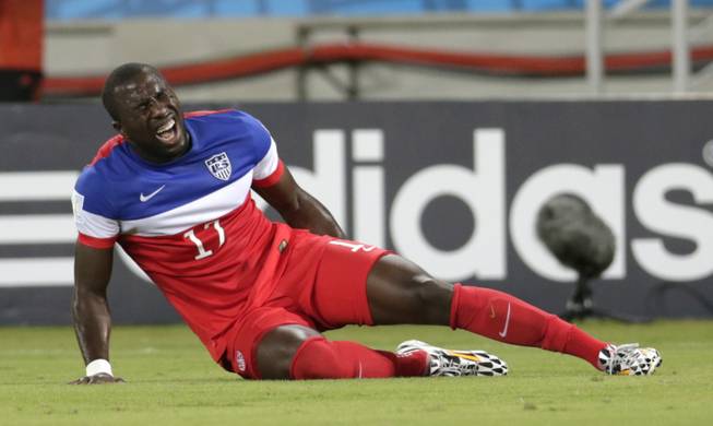 United States' Jozy Altidore grimaces after pulling up injured during the group G World Cup soccer match between Ghana and the United States at the Arena das Dunas in Natal, Brazil, Monday, June 16, 2014.  (AP Photo/Dolores Ochoa)
