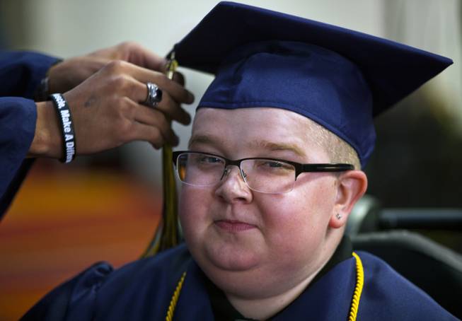 Colton Shrum has his tassel arranged before his graduation ceremony for the Odyssey Charter School at the Cashman Center on Tuesday, June, 3, 2014.