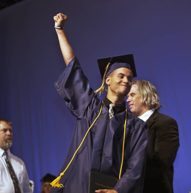 Darius Martin celebrates as he receives his diploma during the Odyssey Charter School graduation at the Cashman Center on Tuesday, June, 3, 2014.