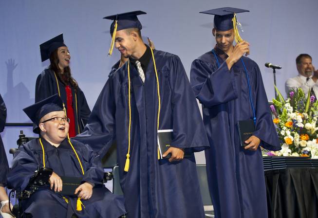 Lifelong friends Darius Martin, Colton Shrum and D'Aron Martin are all smiles during the Odyssey Charter School graduation at the Cashman Center on Tuesday, June, 3, 2014.