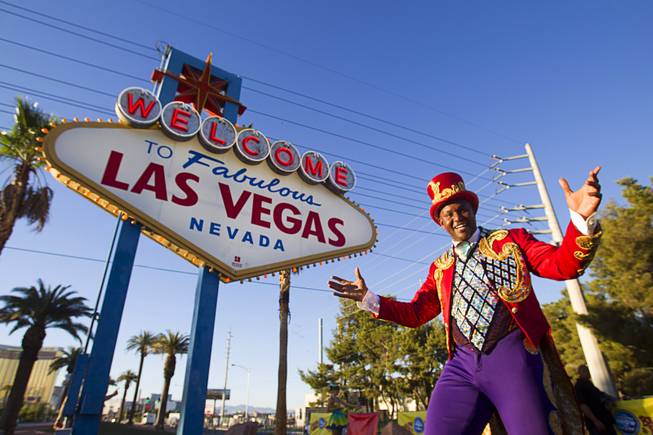 Ringling Bros. and Barnum & Bailey Circus Ringmaster Johnathan Lee Iverson poses at the Welcome to Fabulous Las Vegas sign Wednesday, June 18, 2014. The circus performs at Thomas & Mack Center Thursday through Sunday.