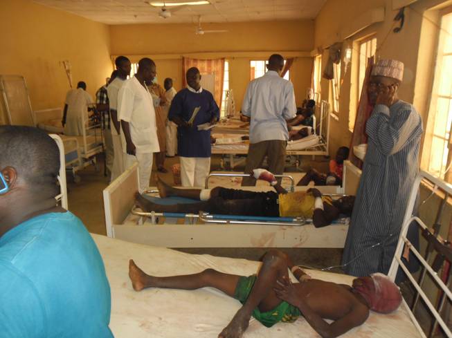 Victims of a suicide bomb explosion at a World Cup viewing center receive treatment at Sani Abacha specialist hospital in Damaturu, Nigeria, Wednesday, June 18, 2014.