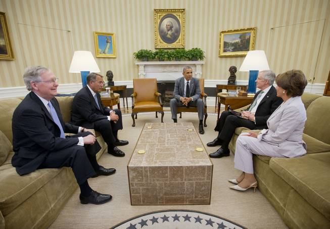 President Barack Obama meets with, from left, Senate Minority Leader Mitch McConnell of Ky., House Speaker John Boehner of Ohio, Senate Majority Leader Harry Reid of Nev., and House Minority Leader Nancy Pelosi of Calif., in the Oval Office of the White House in Washington, Wednesday, June 18, 2014. 
