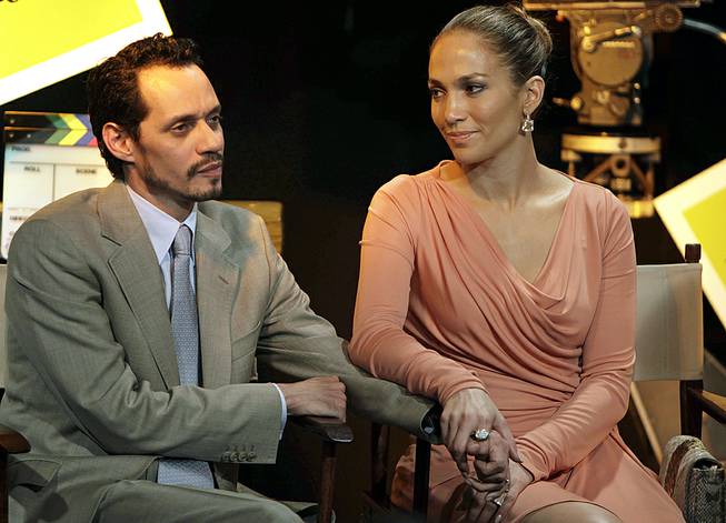 Jennifer Lopez and husband Marc Anthony attend a signing ceremony for filmmaking incentive legislation for the U.S. island territory in Bayamon, Puerto Rico, March 4, 2011. 
