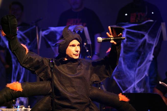 A performer in a spider costume takes the stage during a benefit show for Jerry Jones at Lounge at the Palms on Wednesday, June 18, 2014.