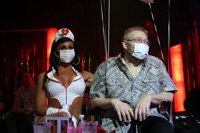 Nurse Jen and Jerry Jones watch performers during a benefit show at Lounge at the Palms on Wednesday, June 18, 2014, to help raise money for his medical bills.