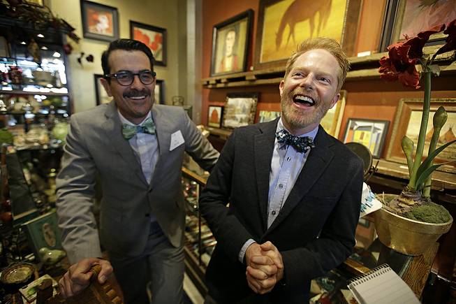 Ty Burrell and Jesse Tyler Ferguson of "Modern Family" laugh during an interview Thursday, June 19, 2014, in Salt Lake City. Burrell is headlining a fundraiser in Salt Lake City on Thursday, an event staged by an organization that Ferguson and his real-life husband created to help pay for the legal costs of challenging same-sex marriage bans.