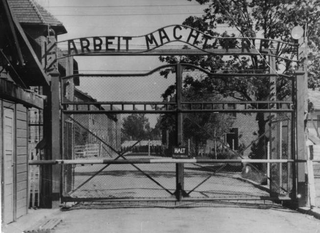 An undated file image shows the main gate of the Nazi concentration camp Auschwitz I, Poland, which was liberated by the Russians, January 1945. Writing over the gate reads: "Arbeit macht frei" (Work makes free - or work liberates). Johann Breyer, 89 faces possible extradition. A German court has charged him with aiding in the killing of 216,000 Jewish men, women and children during World War II.