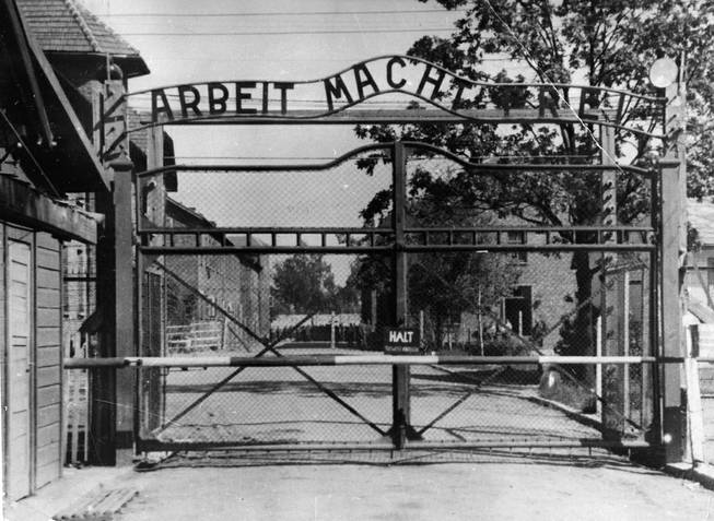 This undated file image shows the main gate of the Nazi concentration camp Auschwitz I, Poland, which was liberated by the Russians, January 1945. Writing over the gate reads: "Arbeit macht frei" (Work makes free — or work liberates). Johann Breyer, 89, who has admitted he was an SS guard at Auschwitz in occupied Poland, faces possible extradition to Germany.
