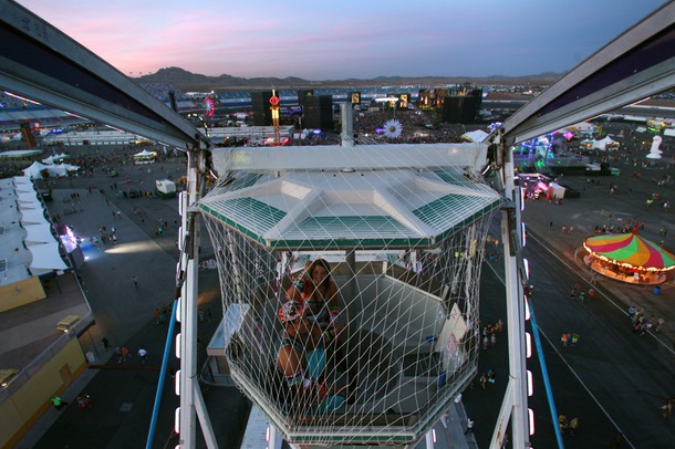 A couple takes a ride in a Ferris wheel during the first night of the Electric Daisy Carnival Friday, June 20, 2014 at the Las Vegas Motor Speedway.