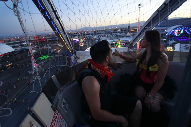 Jose Nunez and Nallely Rodriguez get a view of the festival grounds during the first night of the Electric Daisy Carnival Friday, June 20, 2014 at the Las Vegas Motor Speedway.