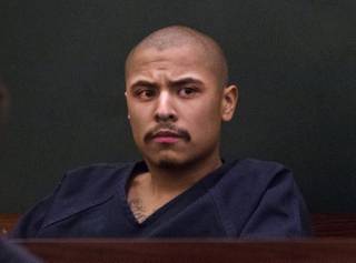 Julio Renteria sits during his preliminary hearing at the Justice Center with Adrian McClintock on Friday, June 20, 2014. The two are suspects in a Boulder Highway carjacking gone awry that ended in Dylan Joshua Salazar's fatal shooting.