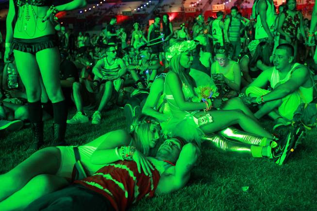 Attendees relax in the Cosmic Meadow during the first night of the Electric Daisy Carnival on Saturday, June 21, 2014, at Las Vegas Motor Speedway.