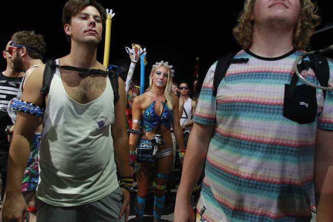 Attendees listen to a set by Booka Shade during the first night of the Electric Daisy Carnival Saturday, June 21, 2014 at the Las Vegas Motor Speedway.