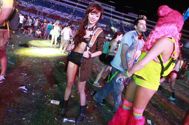 Attendees mill about the Cosmic Meadow area during the first night of the Electric Daisy Carnival early Saturday, June 21, 2014 at the Las Vegas Motor Speedway.