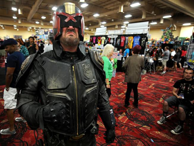 Adam Stines poses as the movie character Judge Dredd during the Las Vegas Comic Con at the South Point Convention Center on Saturday, June 21, 2014.