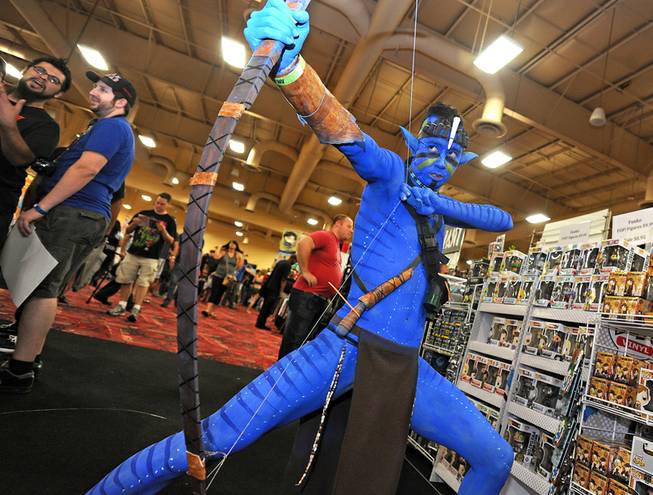 Yasu Tano of Las Vegas poses in costume as a Na'vi from the movie "Avatar" during the first day of the Las Vegas Comic Con at the South Point Convention Center on Saturday, June 21, 2014.