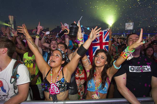 Christina Garcia, left, and Rachel Zabsf of Simi Valley, Calif. are shown at the kineticFIELD during the final day of the 2014 Electric Daisy Carnival (EDC) at the Las Vegas Motor Speedway Sunday, June 22, 2014.