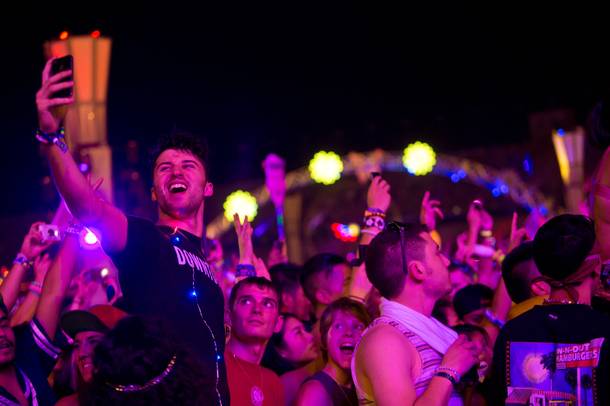 A festivalgoer takes a selfie during Kaskade's set on Night 2 of the Electric Daisy Carnival on Saturday, June 21, 2014, at Las Vegas Motor Speedway.