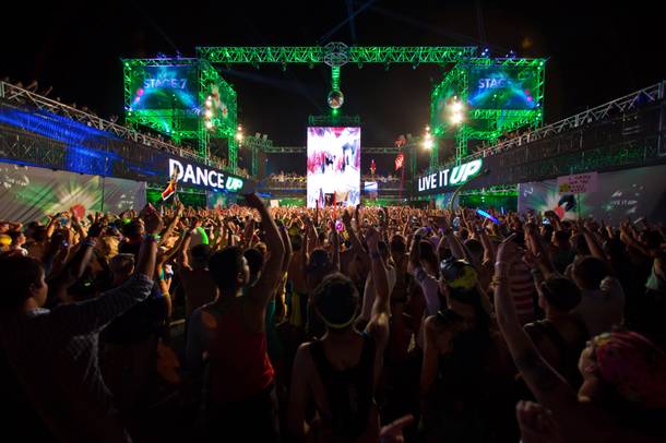 Attendees dance to the music of Party Favor during night 2 of EDC, Saturday June 21, 2014 at the Las Vegas Motor Speedway.