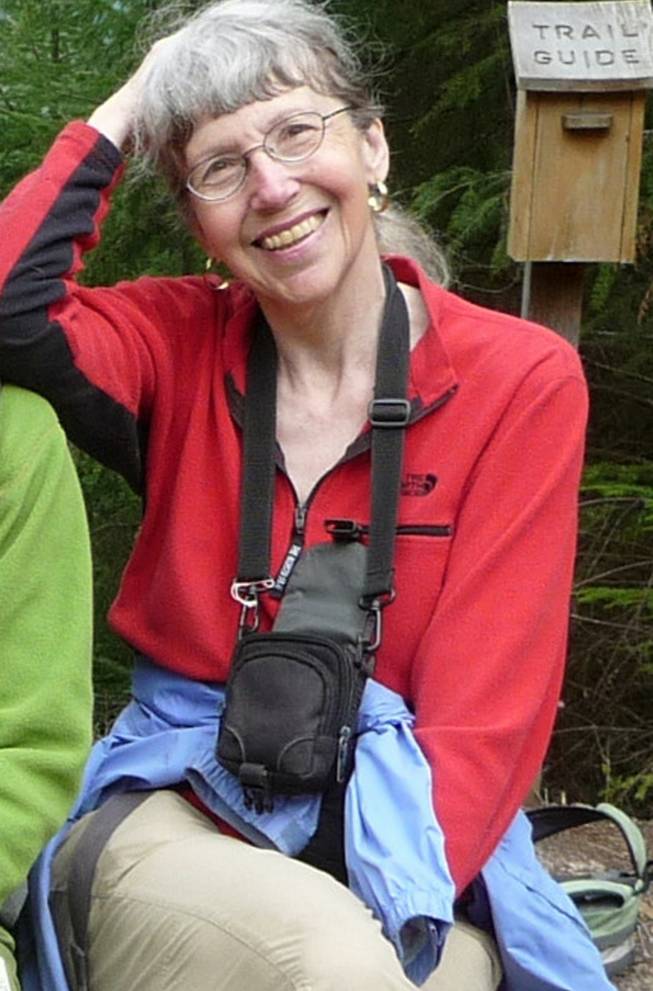 This undated photo provided by Lola Kemp shows Karen Sykes. Crews have been searching Mount Rainier National Park for Sykes, an outdoors writer, who was reported missing late Wednesday, June 18, 2014, while she researched a story. The search was suspended Saturday when a female's body was recovered, though the remains weren't immediately identified.