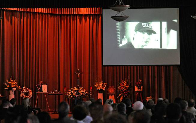A video monitor displays an image of Joseph Wilcox during a memorial service for him at Palm Downtown Mortuary and Cemetery on Sunday, June 22, 2014. Wilcox, 31, was killed trying to stop Jerad and Amanda Miller in the midst of their shooting spree at an east valley Walmart store on June 8.