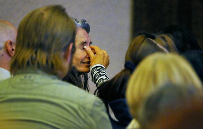 Debra Wilcox, mother of of Joseph Wilcox wipes her eyes during a memorial service at Palm Downtown Mortuary and Cemetery on Sunday, June 22, 2014. Wilcox, 31, was killed trying to stop Jerad and Amanda Miller in the midst of their shooting spree at an east valley Walmart store on June 8.
