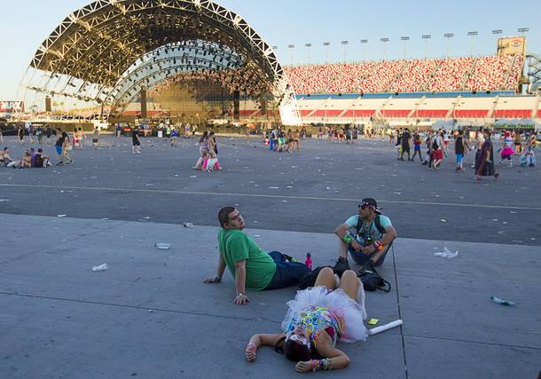 Fans relax on the pavement after the final night of the 2014 Electric Daisy Carnival (EDC) at the Las Vegas Motor Speedway Sunday, June 22, 2014.