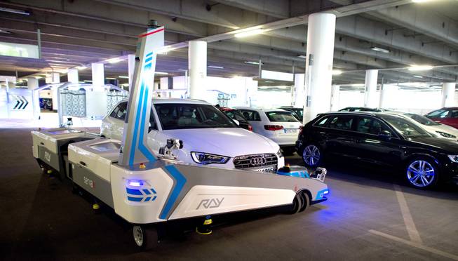 Parking robot "Ray" transports a car in Duesseldorf, Germany, Monday, 23 June 2014. The parking robot will see service for the first time at Duesseldorf Airport.