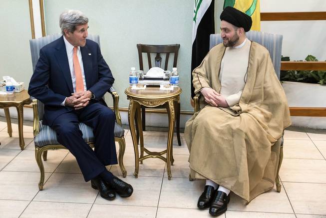 Ammar al-Hakim, right, head of the Shiite Supreme Islamic Iraqi Council, meets with U.S. Secretary of State John Kerry, left, in Baghdad on Monday, June 23, 2014.