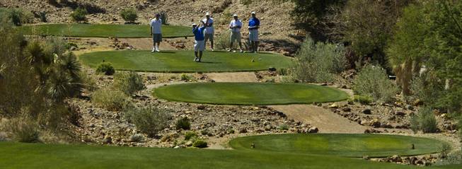 Golfers tee off as HELP of Southern Nevada hosts its 20th Annual Golfers Roundup at Cascata Golf Course in Boulder City on Tuesday, June 24, 2014.