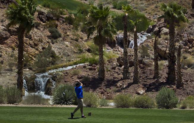 A golfer tees off as HELP of Southern Nevada hosts its 20th Annual Golfers Roundup at Cascata Golf Course in Boulder City on Tuesday, June 24, 2014.