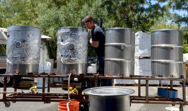 Army veteran Eric Johnson, of Fremont, checks on a cooling brew at Uncle Sam&apos;s Misguided Brewery in Livermore, Calif., on Monday, May 26, 2014. The brewery is run by fellow veterans and co-owners Josh Laine and Fara Eve Barnes.